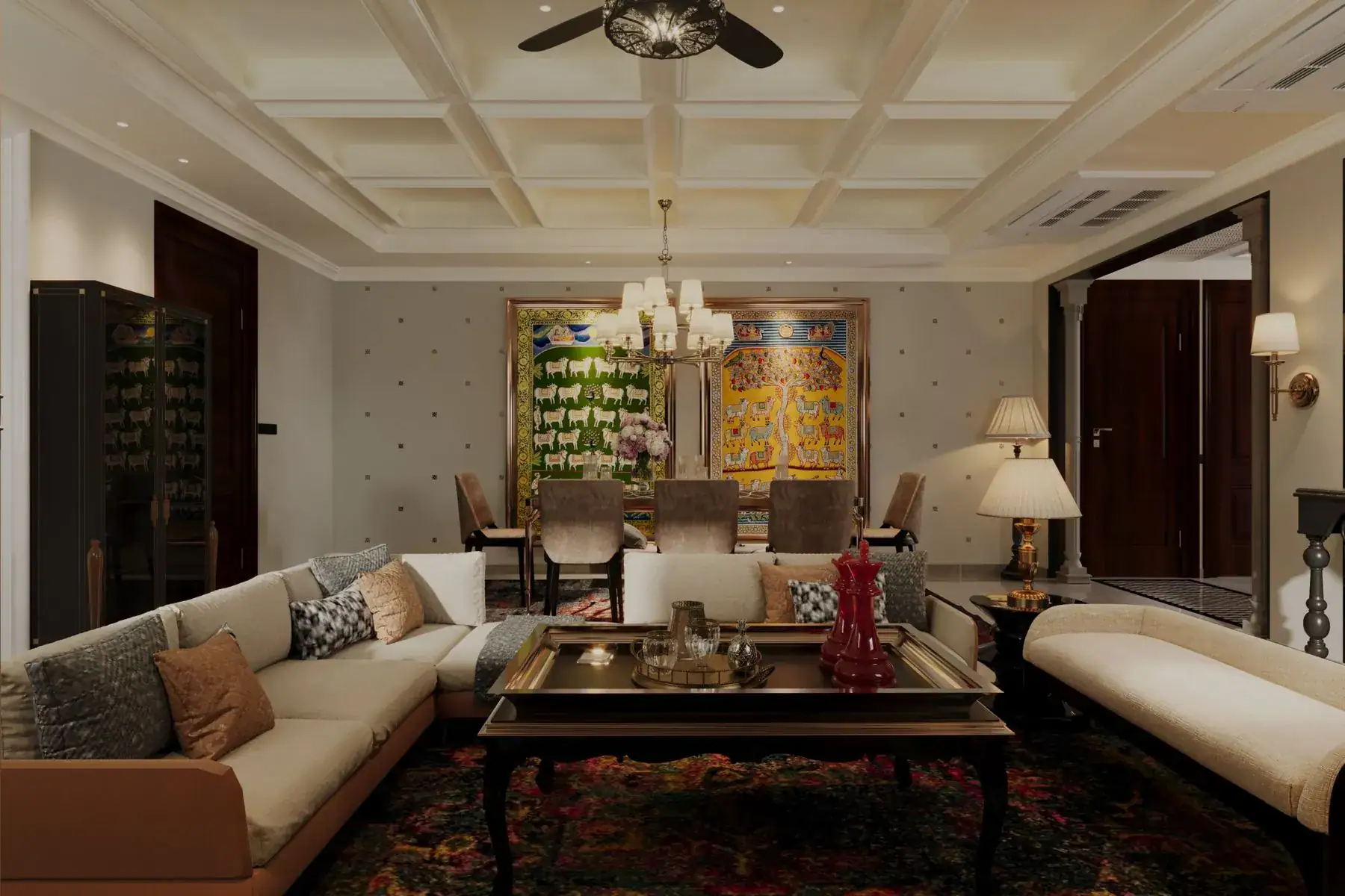 Living and dining room in a Jaipur duplex with coffered ceiling, Pichwai painting, chandelier and tan leather sofa